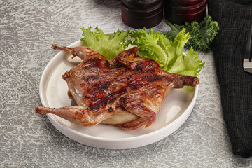 Grilled quail in the plate