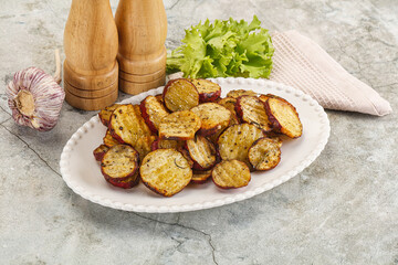 Baked red batat slices with herbs