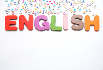 English letters scattered on white background with space for design. Language learning concept.