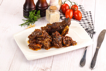 Prepared tasty beef ribs with sauce