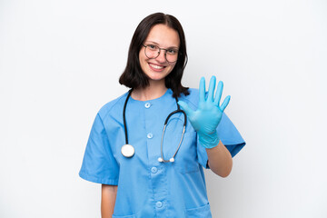 Young nurse caucasian woman isolated on white background counting five with fingers