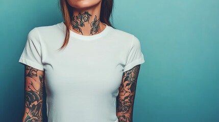 A tattooed woman wearing a white t-shirt.