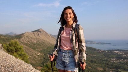 Woman enjoying on the beautiful mountain while hiking