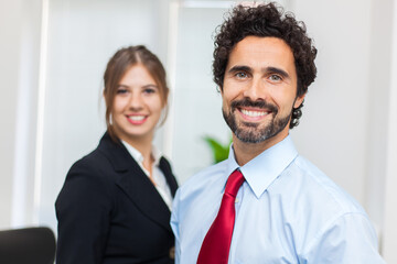 Professional team smiling in office environment