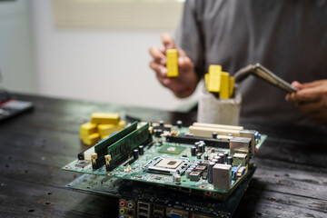 Factory worker overseas molten metal pouring into mold, surrounded by glowing heat in a steel foundry. Microchips and computer hardware components semiconductor and gold metal manufacturing.