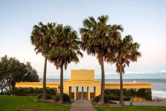 Oak Park Pavillion in Cronulla with palm trees at sunset