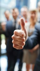 A man is giving a thumbs up to a group of people