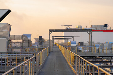 Fototapeta premium outdoors; work; man; men; people; industry; construction; site; job; production; metalwork; safety; worker; industrial; manufacturing; installation; heavy; equipment; real people; technology; structur