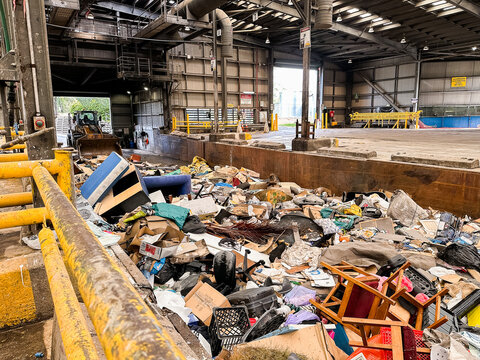 piles of garbage at a dump facility