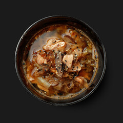 Traditional dish of Asian cuisine, soup, black background view from above