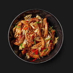 Traditional Asian dish seafood salad, rice, wok, top view, dark background