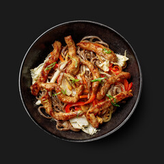 Traditional Asian dish seafood salad, rice, wok, top view, dark background