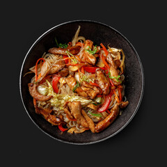 Traditional Asian dish seafood salad, rice, wok, top view, dark background