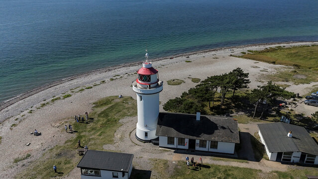 drone photo of peaple and the lighthouse in mols bjerge denmark