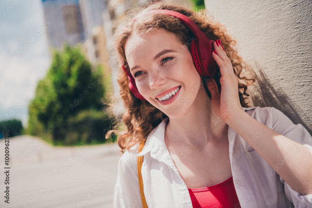 Poster Photo of pretty sweet woman walk street headphones listen music dressed white shirt outdoors urban modern town