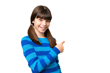 Little caucasian girl over isolated background pointing back