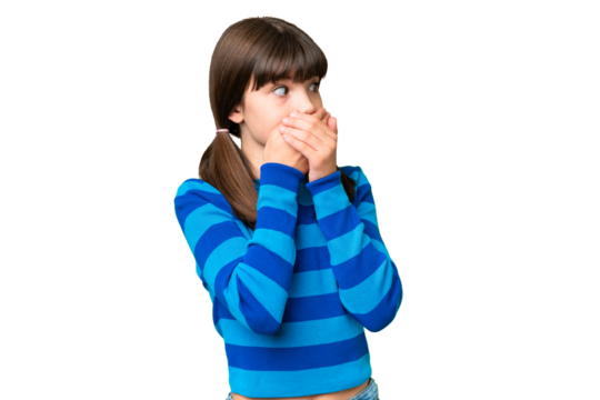 Little caucasian girl over isolated background covering mouth and looking to the side
