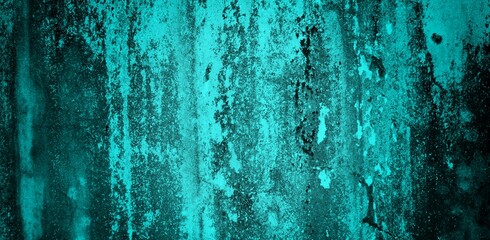 The background of the long wall is green with a combination of blue, Close-up of the facade of a building. Sunlight. Natural colors.