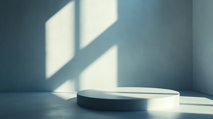 A white, circular podium in an empty white room with a window and sunbeams.
