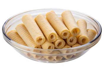 Rolled wafer cookies in a glass bowl isolated with transparent background.