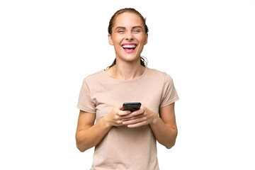 Young caucasian woman over isolated background surprised and sending a message