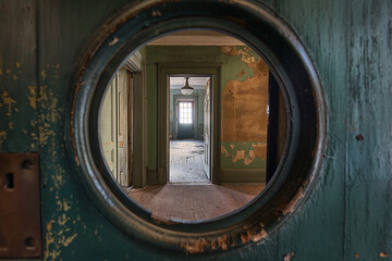 POV looking through a peephole into an empty flat