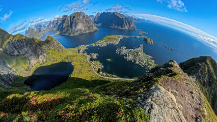 Fisheye view of typical Lofoten lanscape with the ocean, mountains and the village of Reine. 