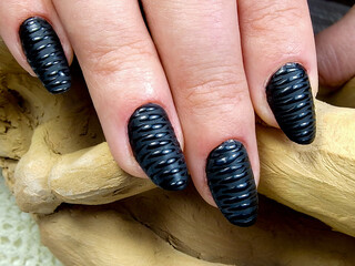 Close-up with manicure, black gel nails