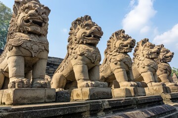 Ornate stone statues of mythical creatures in a temple setting