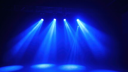 Three Blue Beams of Light Shining Down on Stage