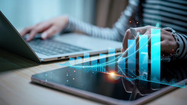 Stock graph with financial chart. Businessman analyzes profitability of working companies with digital augmented reality graphics, positive indicators, long-term investments.