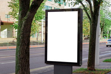 Vertical blank white street billboard in the city. Advertising banner with copy space. Mock up