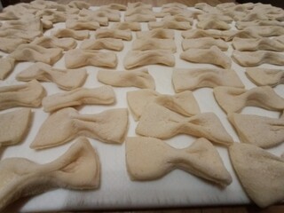 Bows made from dough. Pastries from dough. Homemade pastries. Healthy food. Hand made