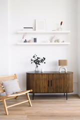 Stylish interior with minimalist furniture and decorative accents in bright room