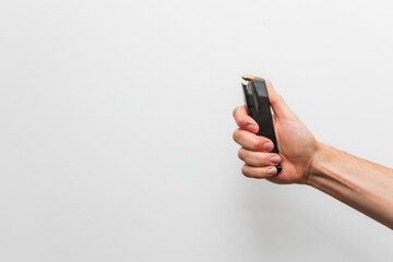 Close-up of a hand holding a pistol magazine.