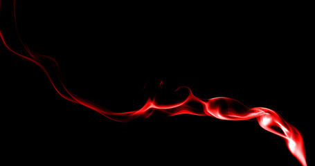red smoke abstract isolated on a black background. concept of texture mist or hot vapor, fog...