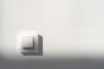 White light switch on copy space wall