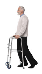 Senior man using walking frame on white background