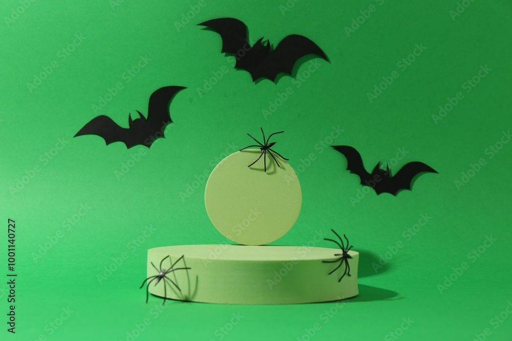 Wall mural Presentation of product. Podiums and Halloween decor on green background. Space for text