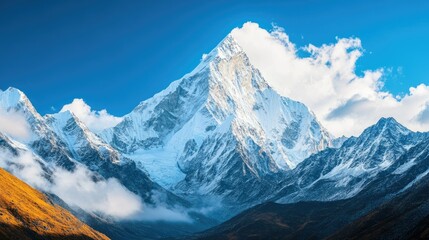 Obraz premium Snow-Capped Mountain Peaks Under Clear Blue Sky