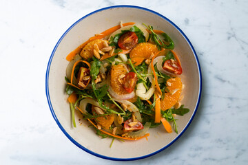 Healthy green fennel and mandarin salad. Top view table with  decorations.