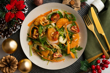Healthy green fennel and mandarin salad. Top view table with Christmas decorations.