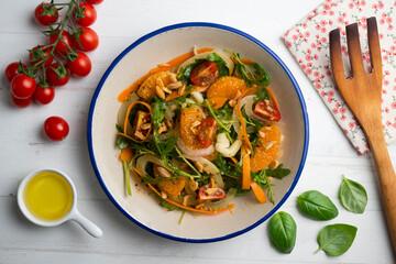 Healthy green fennel and mandarin salad. Top view table with  decorations.