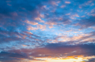 Sunset sky background, colorful sunset sky panoramic view. Vast panoramic sunset sky with dramatic colorful clouds