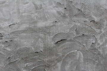 Rough surface of grey concrete wall background. Grey cement with stains and scratches texture.