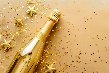 Open a champagne bottle with confetti and sparkles. Birthday anniversary Christmas Valentine day background with copy space. High quality photo