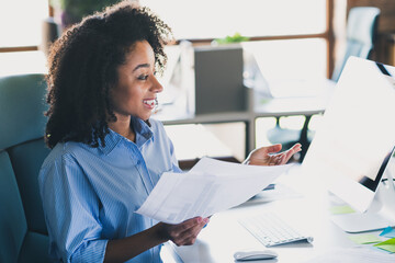 Photo of cheerful positive lady recruiter dressed shirt holding documents talking gadget indoors workplace workstation loft