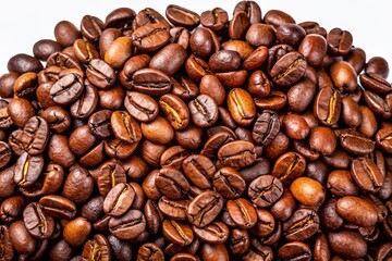 Obraz premium High-quality image of freshly roasted coffee beans scattered on a transparent background, showcasing vibrant brown