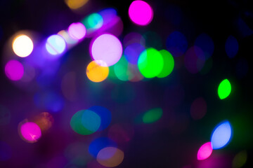 a glass with christmas lights in the background