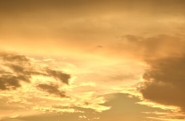 orange dark rain cloud floating on sky at sunset in evening